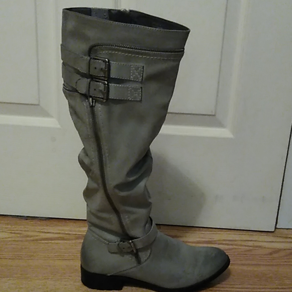 Gray leather boots with zippers and buckles